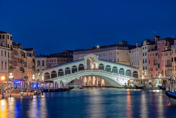 The Rialto Bridge over the Grand Canal in Venice, Italy at night