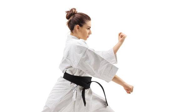 Young woman practicing karate