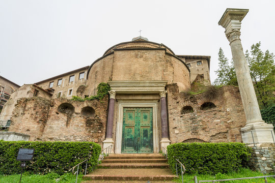 Temple of Romulo in the Roman Forum. Old green door with purple columns.