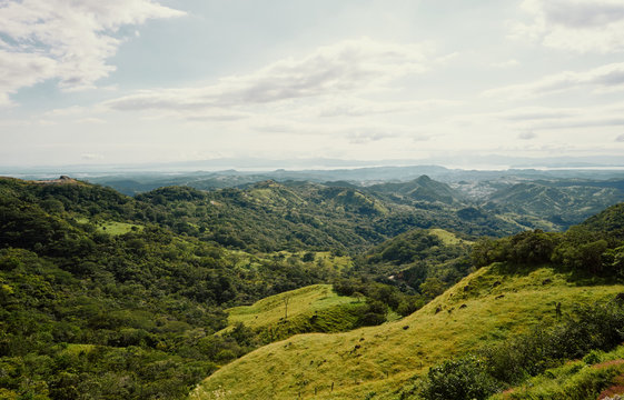 From above scenic landscape of range of green mountains and rain forests in Costa Rica