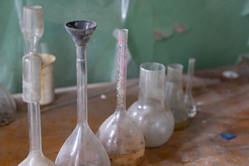 Vintage equipment of chemical laboratory on wooden table