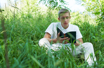 student with book at outdoor
