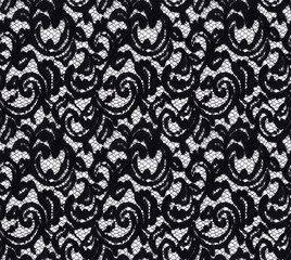 Seamless pattern in the form of an elegant black lace on a white background. Lace with floral motifs.Material for stylish graphic decoration. - obrazy, fototapety, plakaty