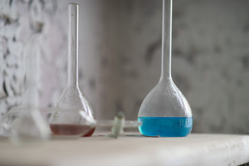 Vintage equipment of chemical laboratory on wooden table