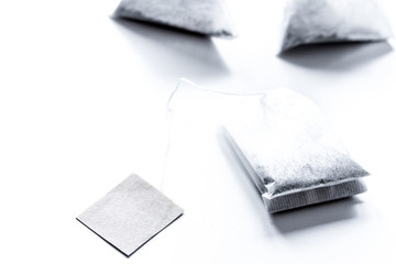 Tea in teabags on white table mock up