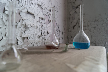 Vintage equipment of chemical laboratory on wooden table