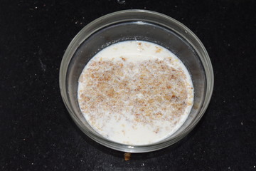 Bowl of wheat mixed with hot low fat milk and honey