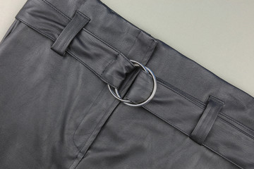 Black leather belt on a skirt.