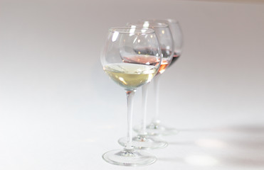 Colorful wine types in glasses on white background