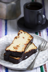 Lviv cheesecake, a traditional Ukrainian dessert with raisins, coated with chocolate icing.