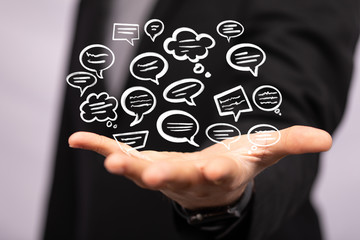 Digital icons with colorful dialog speech bubbles.