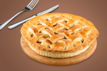 Delicious baked sweet pie on desk