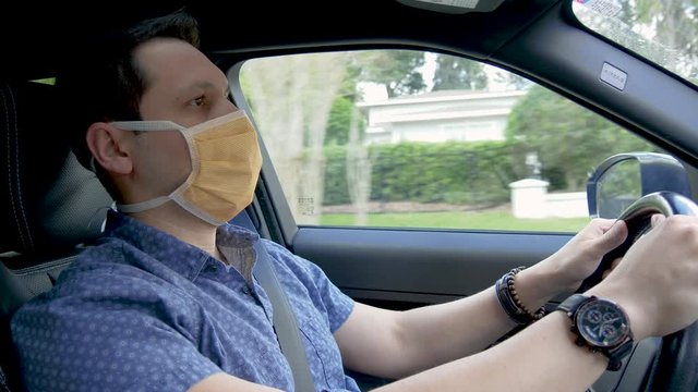409 Man driving wearing a face mask Covid-19