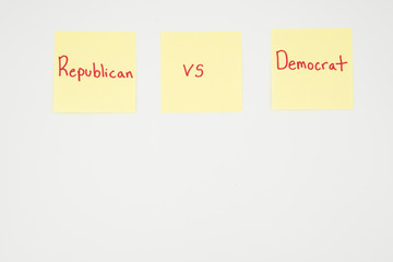 Republican versus Democrat written on a yellow sticky note with copyspace. Presidential election 2020