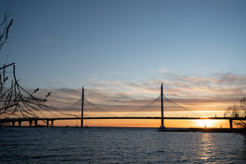 bridge over the river at sunset.