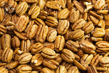Pecan nuts background. Closeup pekan seeds