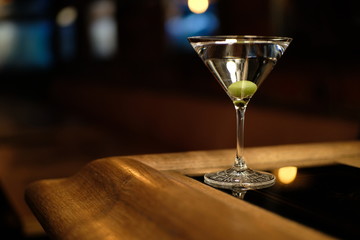 gin martini with olive cocktail in beautiful glass