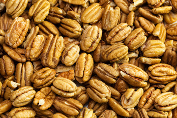 Pecan nuts background. Closeup pekan seeds