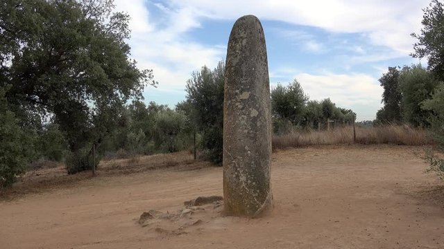 Isolated single Menhir stone near the Almendres Cromlech megalithic complex at Evora district.  Guadalupe, Evora, Alentejo, Portugal.