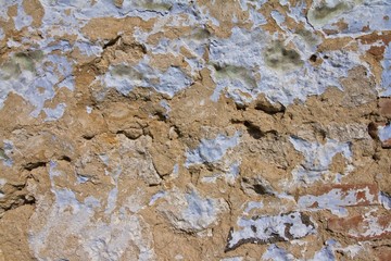 horizontal surface of ancient clay house wall, rough, shabby, abstract background texture architectural free space background