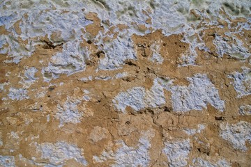 horizontal surface of ancient destroyed clay house wall, rough, shabby, abstract background...