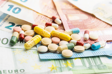 Syringe and euro money. Healthcare concept.