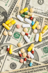 Pills and usa dollars money. Healthcare concept.