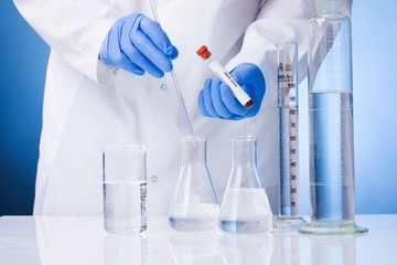 Coronavirus blood test result, blood infected with coronavirus in vacuum test tube in doctors hands with text Coronavirus in laboratory. Diagnosis, detection, analysis of Chinese coronavirus. Epidemic