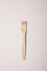 fork isolated on beige background