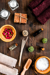spa cosmetics with soap, salt, oil on white background top view