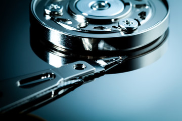An open computer hard drive for repair. HDD. Components for ps. Storage and restoration of digital...