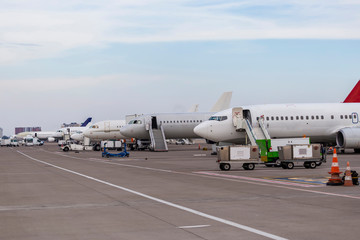 Fototapeta na wymiar Passenger planes sorted at airport in Turkey