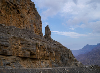 Face shaped rock statue on Jebel Say Road in evening light leading up to Jebel Harin in Musandam