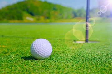 Golf ball on the green.
