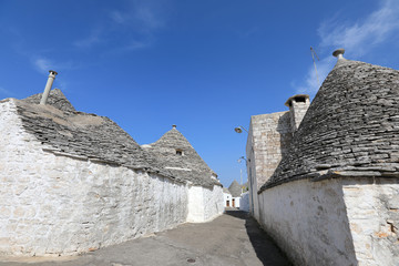 Fototapeta na wymiar Cityscape of typical trulli houses in Alberobello Italy