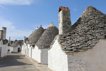 Fototapeta na wymiar Cityscape of typical trulli houses in Alberobello Italy
