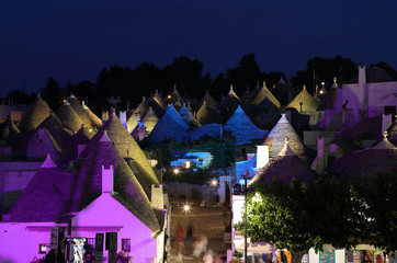 Fototapeta premium Night View of typical trulli houses in Alberobello Italy