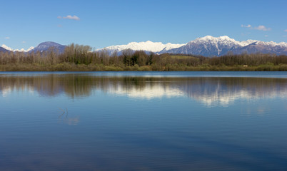 Fototapeta na wymiar Ragogna Lake, Italy, in Late Winter