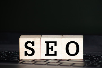 close up of wooden blocks making SEO word. Search engine optimization