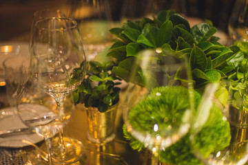 glass of white wine on table in garden