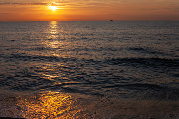 Beautiful sunset over sea at Tuscany, Italy
