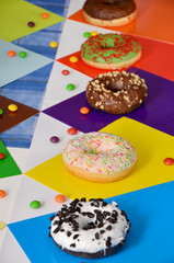 different donuts with chocolate and sprinkles 