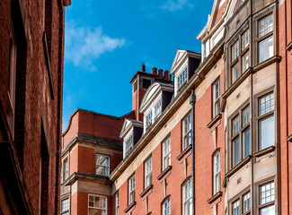 Fototapeta na wymiar Traditional British Red Brick Architecture with Blue Sky in Newcastle upon Tyne, UK