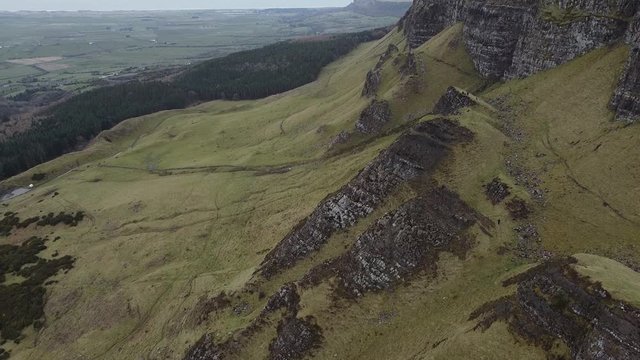 Drone aerial footage of Binevenagh Mountain and cliffs, North Sperrins, Causeway Coast and Glens, Limavady, County Londonderry, Northern Ireland