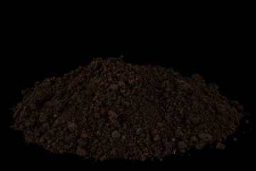 Heap of soil isolated on black background