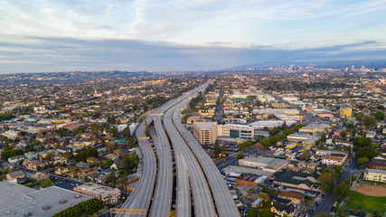 Aerial view of empty freeway streets with no people in downtown Los Angeles California USA due to...