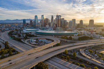 Aerial view of empty freeway streets with no people in downtown Los Angeles California USA due to...