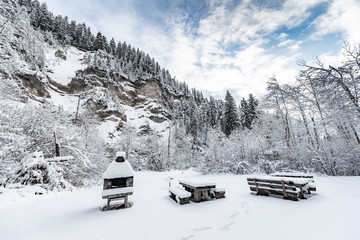 Recreation areas near the Landwasser Viaduct, famous place at winter, landmark of Switzerland, snowing, grill