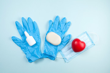 Medical concept - hydro alcohol hand gel, soap, medical mask and latex gloves can save a life.