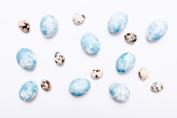 Stylish eggs with ombre blue marble stone effect on white background